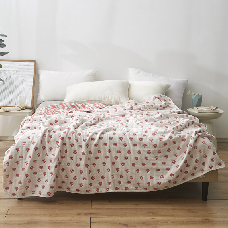 Manta elegante con sutil estampado de hojas