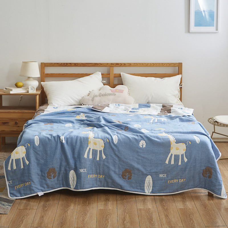 Manta elegante con sutil estampado de hojas