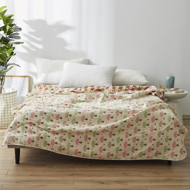 Manta elegante con sutil estampado de hojas