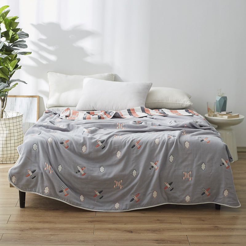 Manta elegante con sutil estampado de hojas