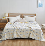 Manta elegante con sutil estampado de hojas