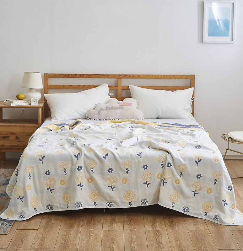 Manta elegante con sutil estampado de hojas