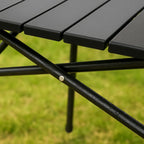 Mesa plegable de exterior con superficie resistente al calor y a los arañazos