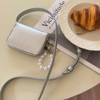 Mini bolso bandolera tipo clutch