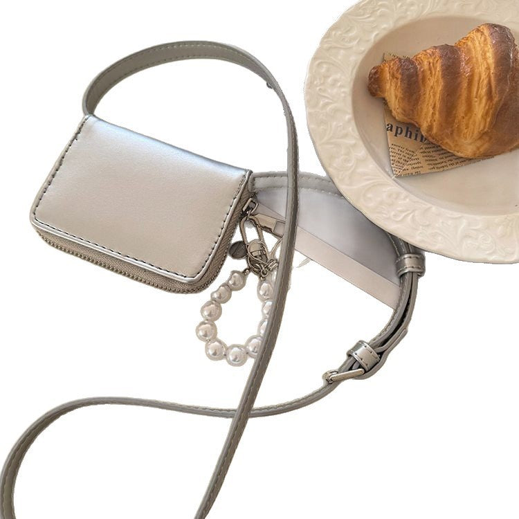 Mini bolso bandolera tipo clutch