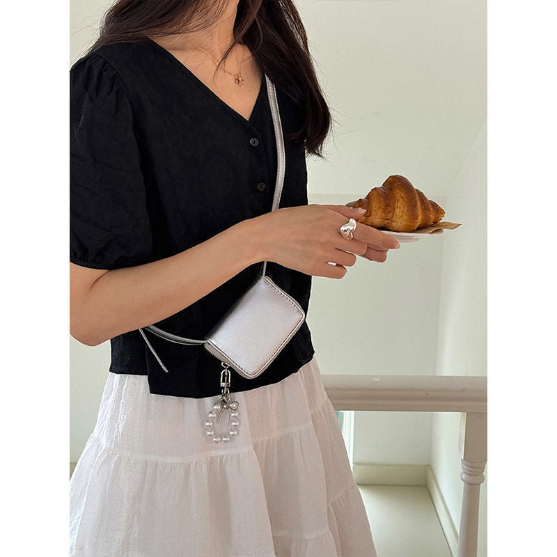 Mini bolso bandolera tipo clutch
