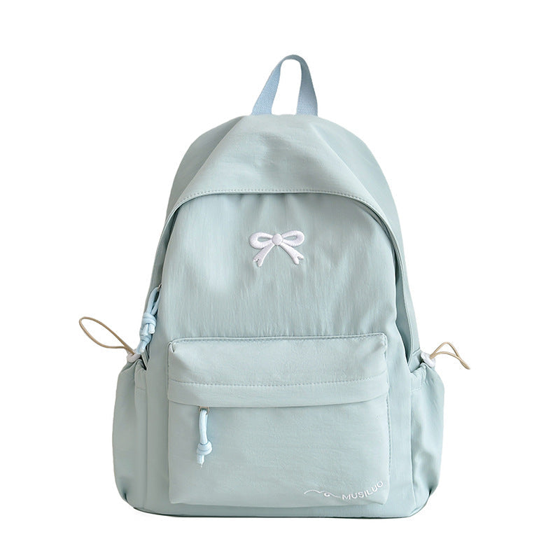 Mochila escolar casual con lazo en relieve, resistente al agua, tirantes acolchados