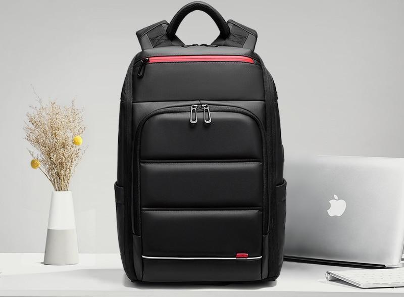 Mochila de viaje para portátil de 15,6 pulgadas con puerto USB y repelente al agua