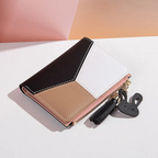 Monedero mini con borla decorativa