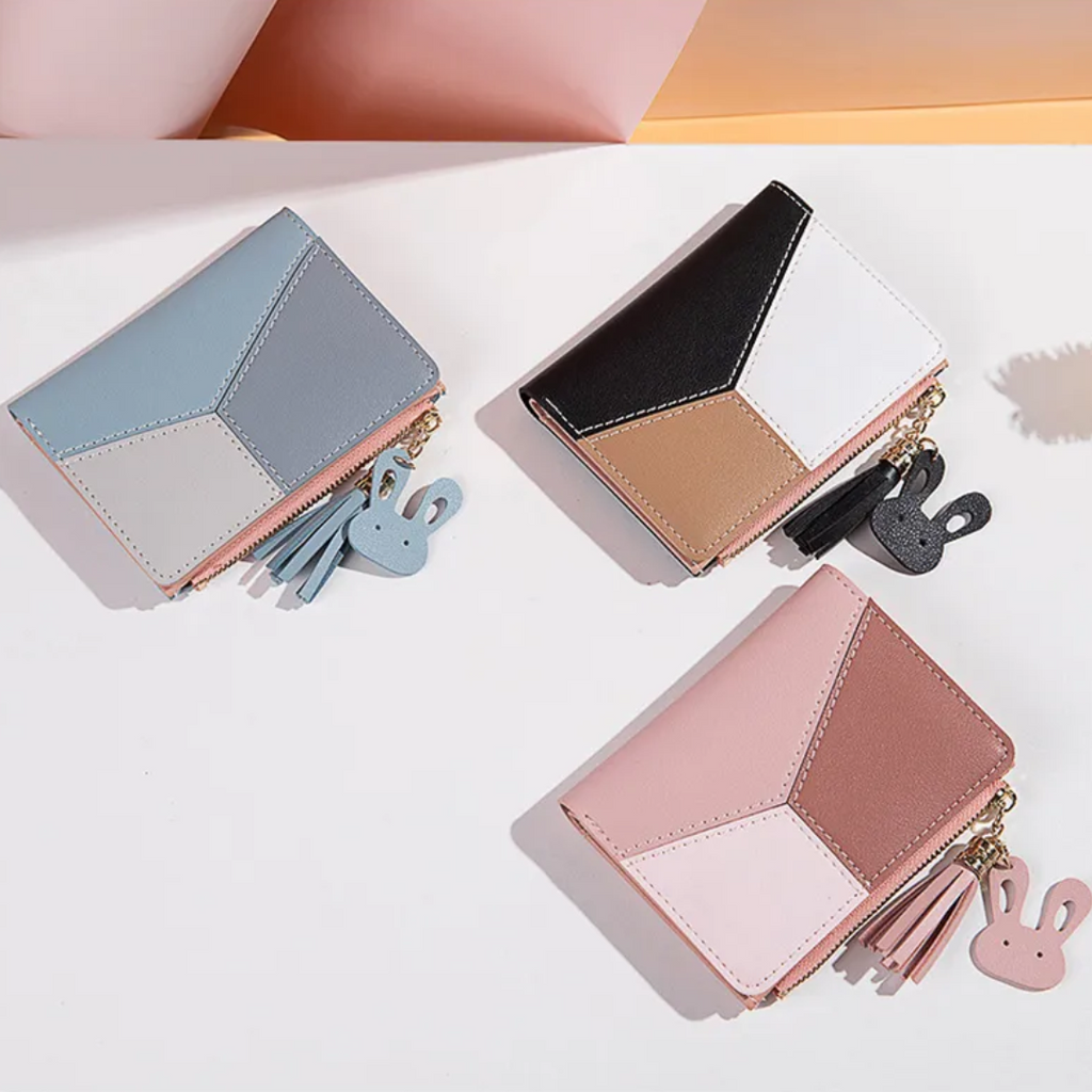 Monedero mini con borla decorativa