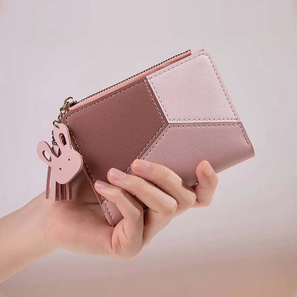Monedero mini con borla decorativa