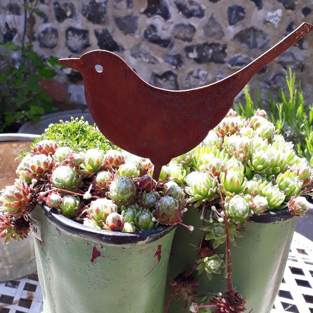 Pájaro decorativo de metal con acabado rústico