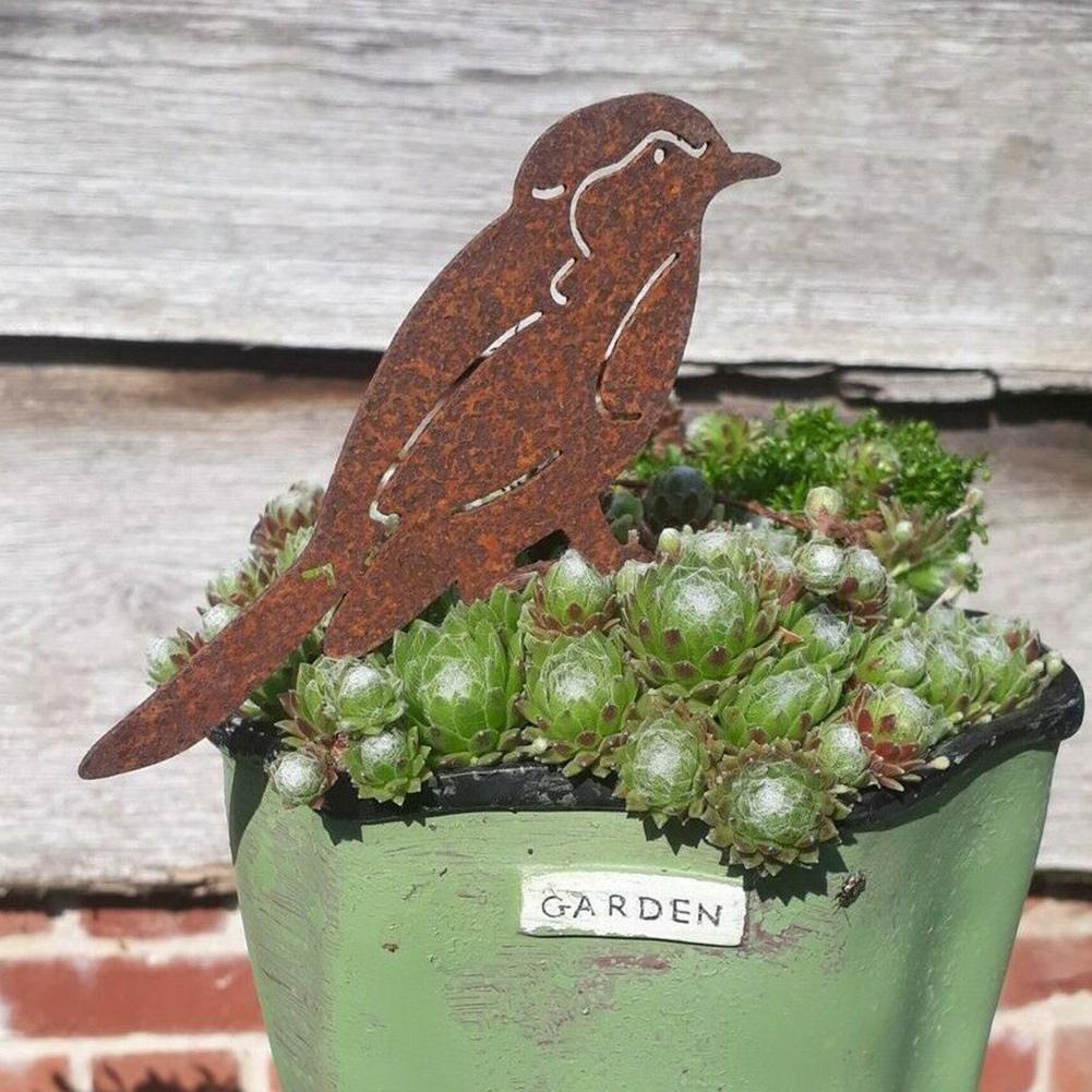 Pájaro decorativo de metal con acabado rústico