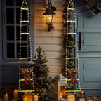 Papá Noel escalando escalera con luces LED para exterior