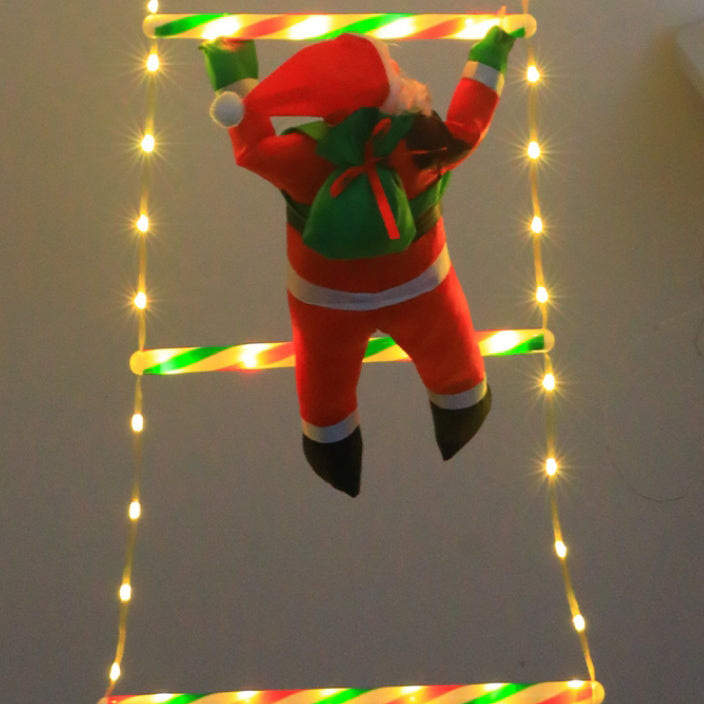 Papá Noel escalando escalera con luces LED para exterior