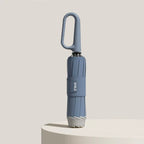 Paraguas plegable con correa de anilla