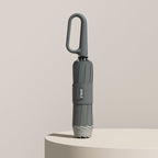 Paraguas plegable con correa de anilla