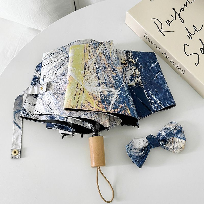 Paraguas plegable para mujer con diseño artístico y apertura automática