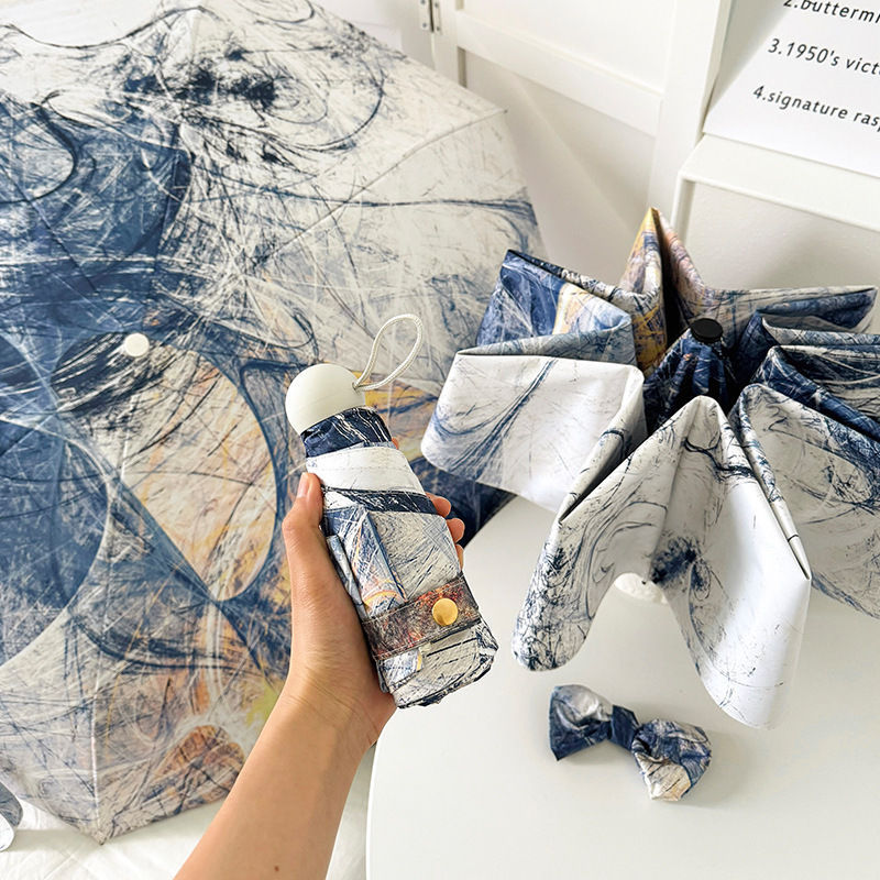 Paraguas plegable para mujer con diseño artístico y apertura automática