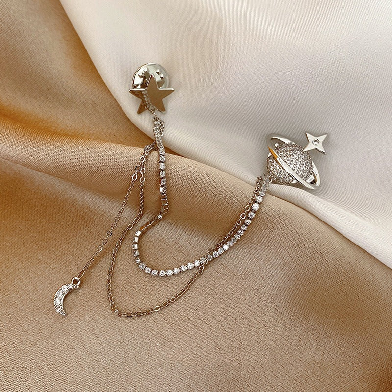 Pendientes de estrella y planeta con cadenas