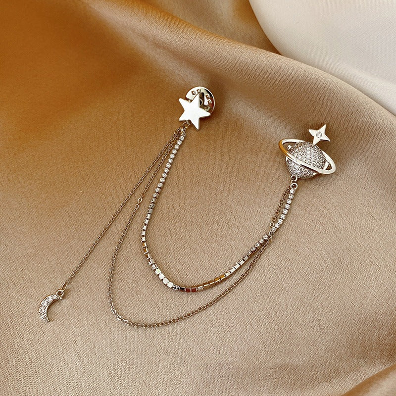 Pendientes de estrella y planeta con cadenas