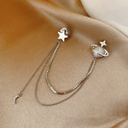 Pendientes de estrella y planeta con cadenas