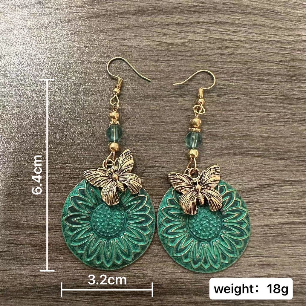 Pendientes elegantes con motivo floral y mariposas