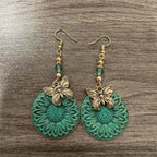 Pendientes elegantes con motivo floral y mariposas