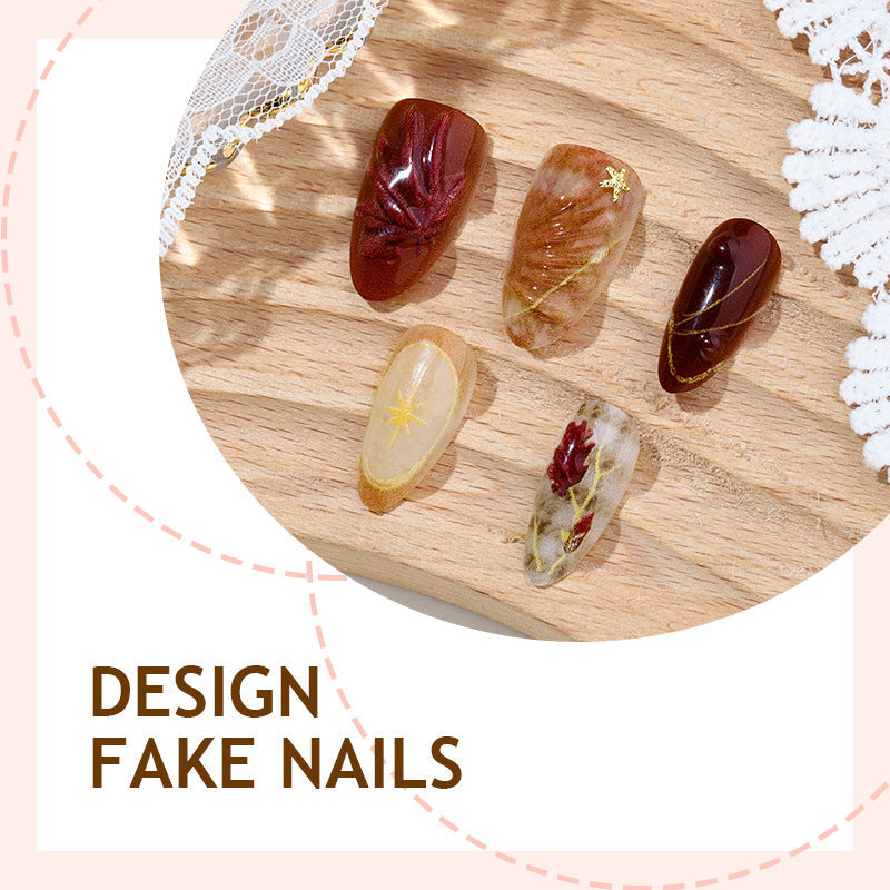 Set de uñas postizas con flores elegantes y brillos