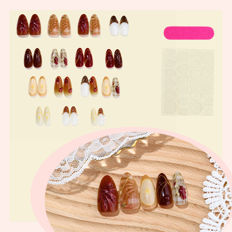 Set de uñas postizas con flores elegantes y brillos