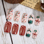 Set de uñas postizas navideñas con diseños festivos