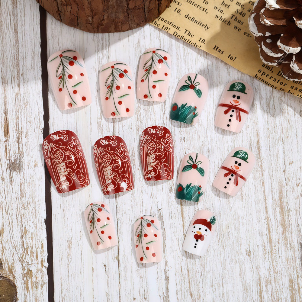 Set de uñas postizas navideñas con diseños festivos
