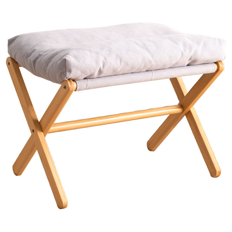 Taburete plegable con asiento acolchado y estructura de madera
