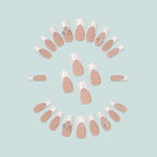 Uñas postizas francesas con purpurina y mariposas