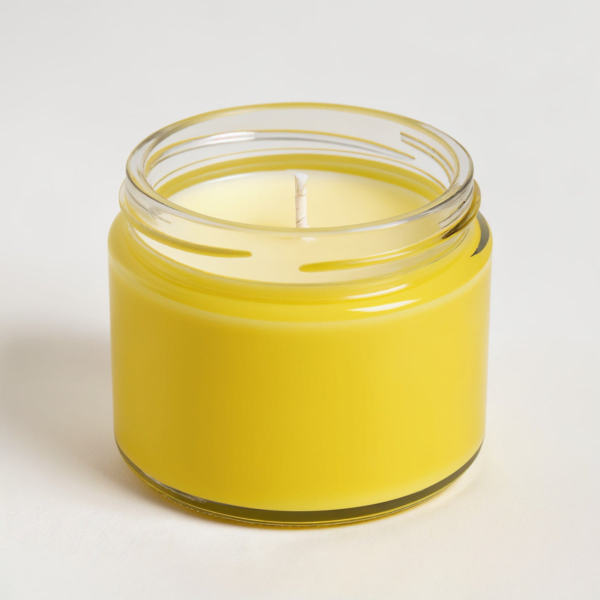 ORNISHOP Lemongrass Soy Candle — Tarro amarillo brillante con diseño minimalista