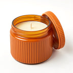 Vela de soja Ginger Spice de ORNISHOP — Tarro naranja con textura acanalada