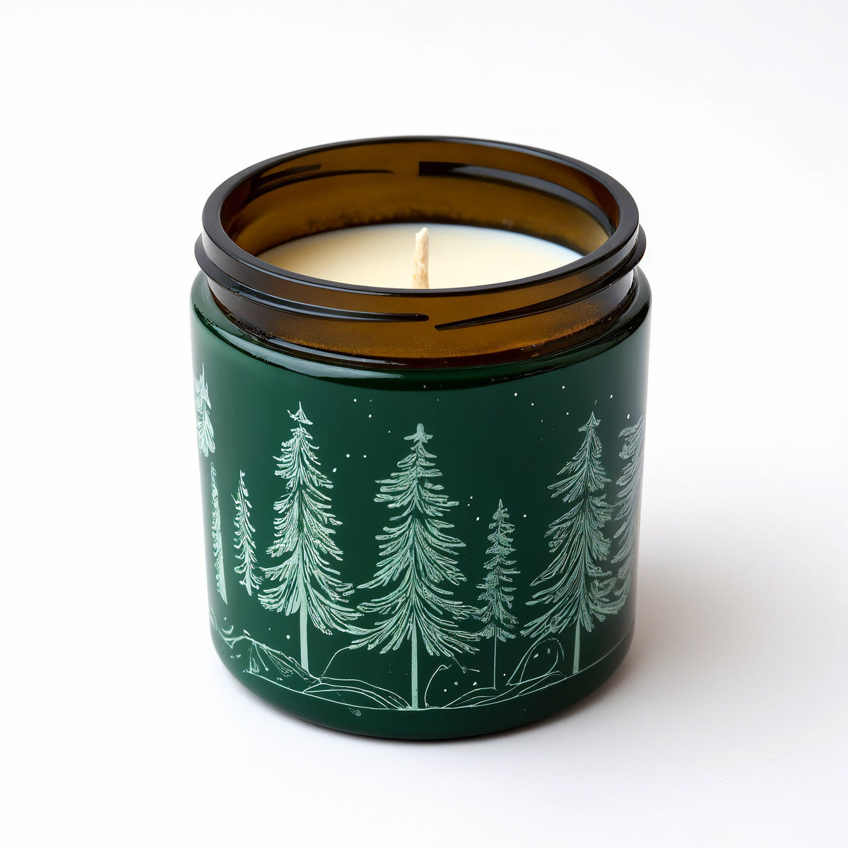 Vela de soja Pine Forest de ORNISHOP — Tarro verde oscuro con motivo de pino