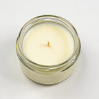 Vela de soja con aroma a verbena de limón en tarro de cristal transparente