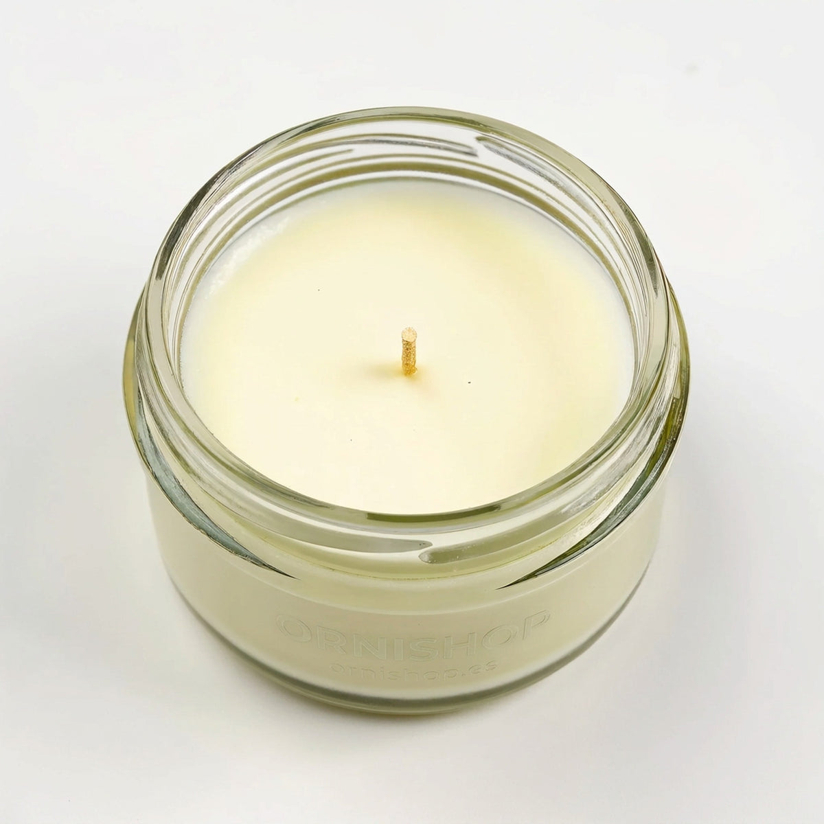 Vela de soja con aroma a verbena de limón en tarro de cristal transparente